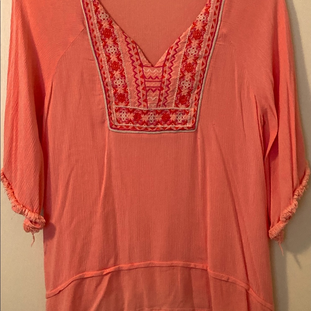 Orange, V-neck blouse w/ bright embroidery @ neck & three-quarter length sleeves